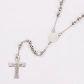 Detailed macro view of stainless steel rosary necklace with St. Benedict medal and cross - Steel