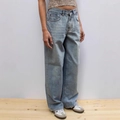 High-waisted light blue wide-leg denim jeans with a vintage washed finish on a model - S / Light Blue