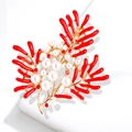 Elegant gold-tone coral branch brooch with red enamel and white pearl accents - Red Coral Pearl