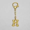 Polished 18k gold plated keychain featuring a 3D bubble style letter H bag charm - Letter H