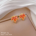 Macro shot of maple leaf earrings with orange zircons and measurement specs - Red Maple Leaf Stud Earrings (E332)