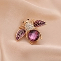 Cute bee brooch with purple gemstone wings and sparkling crystals on golden base - Style 10