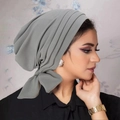 Side view of soft grey knit turban headwrap with four-bar detailing on a female model - Medium Grey
