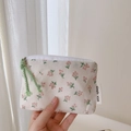 Detail of floral canvas pouch with simple wish label and green woven zipper puller - Light Pink Floral Coin Purse