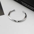 Polished silver Mobius cuff bracelet in a minimalist twisted open design for women - Twisted Glossy / Silver