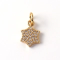 Macro view of gold plated star pendant featuring micro-pave cubic zirconia crystals - 11-Pave Hexagram
