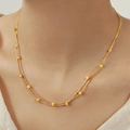 Double-layered gold titanium steel choker with square bead accents worn by a model - Double Layer Cube Necklace / Gold
