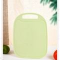 Light green plastic cutting board with non-slip texture and handle for fruit - Green