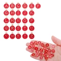 Nahaufnahme von 26 roten Emaille A-Z Buchstabenanhängern in der Hand zur Größe - A-Z Set (26 Stk.) / Rot