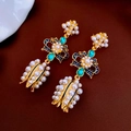 Detail of vintage bow earrings with pearls and blue enamel in a floral basket design - Blue Bow Pearl Style