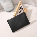 Slim black lychee pattern PU leather zipper wallet shown on a modern desk setup - Black