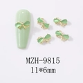 Detalle de adorno para uñas mariposa ojo de gato verde menta 11x6mm con marco dorado - Estilo de Marco Dorado Con Lazo Verde Claro (9815)