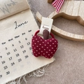 Detail of red checkered fabric apple hair tie on vintage aesthetic background - Polka Dot Apple Hair Tie