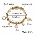 Golden stainless steel cable bracelet with dolphin zircon charms and adjustable band - K-Gold Small Fish Style
