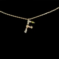 Minimalist 18k gold plated letter F necklace with colorful zircon stones on black background - Letter F / Gold