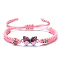 Adjustable pink braided bracelet featuring a butterfly charm with sparkling pavé accents - Pink
