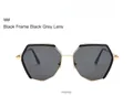 Detail view of stylish geometric hexagonal sunglasses with black frame and gray lenses - Gold Frame Gray Lens