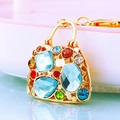 Golden handbag-shaped keychain with multi-color rhinestones and sparkling gems - Blue Crystal Handbag