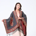 Grey cashmere-feel shawl with red paisley pattern and fringe details on a model - Grey/Border Paisley