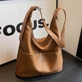 Brown vintage leather hobo bucket bag with adjustable strap and pebble grain texture - Brown