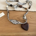 Ethnic bohemian necklace detail with black floral ribbon and dark brown wooden heart pendant - White Paisley Heart Style