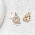 Macro shot of gold letter Q pendant with cubic zirconia and 30mm x 18mm dimensions - Letter Q