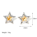 Detail view of two-tone star earrings showing 2.8cm size and 9.4g weight on white background - Silver Frame Gold Star Layered / Gold and Silver