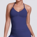 Detail of navy blue seamless knit sports bra with halter V-neck and ruched chest design - Dark Navy Blue