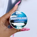 Freedom Ocean Body Glaze moisturizer 2oz tin held by hand for smooth glowing skin - Freedom Ocean / Small