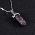 Macro shot of a purple amethyst hexagonal pillar pendant with a silver metal clasp - Pendant + Chain Set / Amethyst