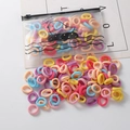 Close-up of colorful elastic hair bands with transparent duck storage pouch - 100 Pieces Set / Mixed Colors