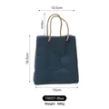 Blue paper bag style ceramic vase with rope handles measuring 16.5cm in height - Sapphire Blue