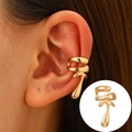 Polished golden streamlined ear cuff with a modern lava flow design for non-pierced ears - KC Gold - Modern Irregular Design (0305)