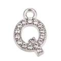 Macro shot of silver alloy letter Q pendant with sparkling white rhinestones for jewelry - Letter Q