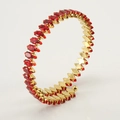 Detail of 18K gold plated open bangle with red marquise cubic zirconia gemstones - Red