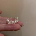 Adjustable silver ring with hollow flower design worn on finger for a stylish minimalist look - J926 Silver a Hollow Flower Open Ring