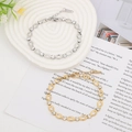 Detail of gold and silver stainless steel bracelets with crystals on ceramic tray - Oval Style (Silver 001)