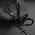 Detail of lava stone and tiger eye bead necklace with metal medal and black cross - 8mm Black Lava Stone No. 3 With Alloy Medal