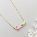 Fashionable golden chain necklace featuring a pink enamel Arabic character pendant with zircons - Pink