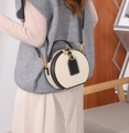 Beige and black leather crossbody bag shown on model with shoulder strap and gold hardware - 17X15X8 / White and Black