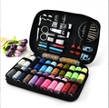 Portable sewing kit in black zipper case with colorful threads and stainless tools - 99-Piece Set