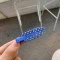 Detailed view of blue denim duckbill hair clip with white polka dots for women styling - Pencil Shape / Blue with White Polka Dot Strip