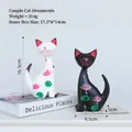 Minimalist black and white cat figurines with pink lotus floral painting 16.5cm tall - Painted Couple Cat Ornaments 12001