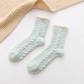 Soft coral fleece mid-calf socks for women in light green with cable knit pattern - Emerald