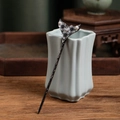 Detail of a vintage Chinese hair pin with grey flowers and pearls on a ceramic vase - Grey Flower Pearl