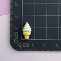 Close-up of a mini 3D resin ice cream cone nail art charm on a metric scale mat - 5*Ice Cream