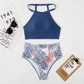 Flat lay of navy halter swim top and tropical leaf high-waisted bikini bottom with props - S / Dark Blue