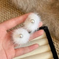 Close-up of white plush fur pom-pom earrings with a central pearl inlay detail - 1# Center Pearl Inlay Style (Silver Needle-White)