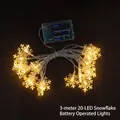 3M 20 LED snowflake fairy string lights with warm yellow glow and battery box - 3m 20-LED Snowflake Battery Powered