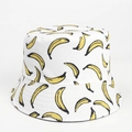 Close-up of a white bucket hat with vibrant yellow banana print and high-quality canvas texture - M (56-58cm) / White
